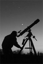 Amatuer Astronomer with Refractor